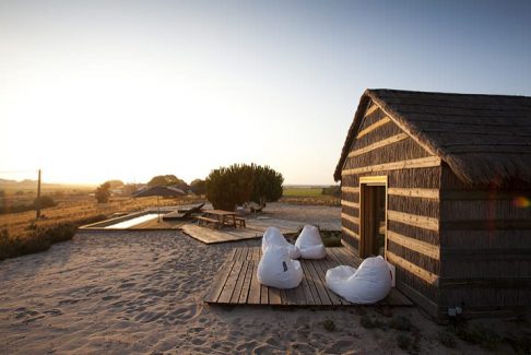 portugal, beach, travel, hotel, sand, Gervasoni, Ghost, CasasNaAreia, Tolomeo, white, thatched, bullrush, pool, boardwalk, Artemide